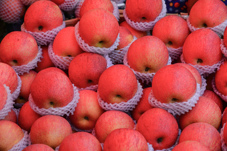 Yummy pile of apples at a market stall in Asia.の写真素材