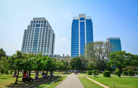 Yangon, Myanmar - Feb 13, 2017. Office buildings with Mahabandoola park in Yangon, Myanmar. Yangon, formerly Rangoon, was the capital of Myanmar.のeditorial素材