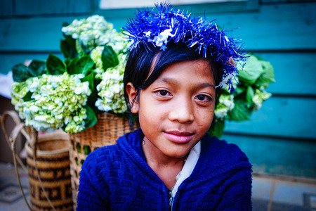 Dalat, Vietnam  - Dec 5, 2015. A Koho girl selling flowers in Dalat, Vietnam. Koho are an ethnic group living in the Dalat township of Central Highlands.のeditorial素材