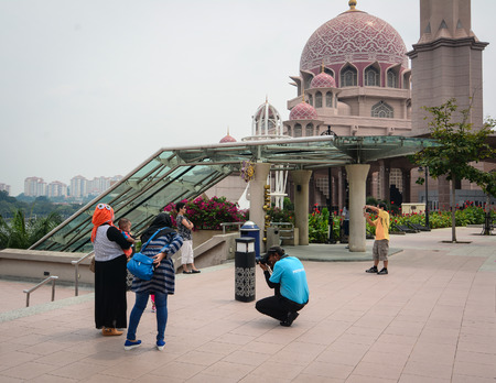 Putrajaya, Malaysia - Jul 7, 2015. People visit the Putrajaya Mosque. Also known as Putra Mosque and it is one of the famous landmark in Putrajaya, Malaysia.のeditorial素材