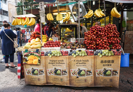 Kuala Lumpur, Malaysia - Jun 6, 2015. Selling fruits at the market in Chinatown, Kuala Lumpur, Malaysia. There are lots of budget hotels and cheap food in this neighborhood.のeditorial素材