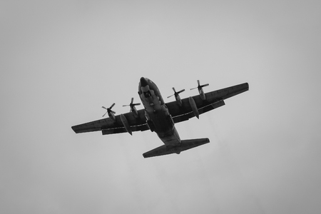 TAIPEI, TAIWAN - JAN 8, 2016. A military airplane flying in the sky in Taipei, Taiwan. Taipei is the political, economic, educational, and cultural center of Taiwan.のeditorial素材