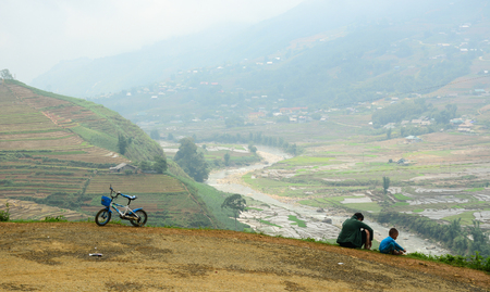 Sapa, Vietnam - May 30, 2016. Children playing on the hill in Sapa, Vietnam. Sa Pa is a frontier township in Lao Cai Province in north-west Vietnam.のeditorial素材