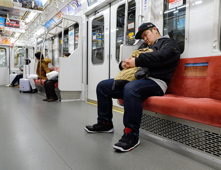 Tokyo, Japan - Jan 3, 2016. People in the metro train in Tokyo, Japan. Tokyo is blessed with one of the world most efficient public transportation systems.のeditorial素材
