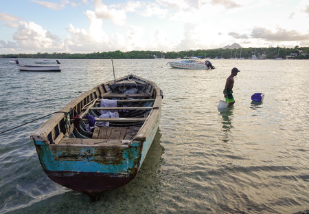 Grand Baie, Mauritius - Jan 11, 2017. Wooden boats on the sea in Grand Baie, Mauritius. Mauritius is a major tourist destination, ranking 3rd in the region and 56th globally.のeditorial素材