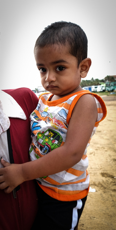 Colombo, Sri Lanka - Sep 7, 2015. Portrait of a boy in Colombo, Sri Lanka. Colombo is a busy and vibrant place with a mixture of modern life and colonial buildings.のeditorial素材