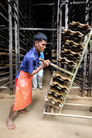 Colombo, Sri Lanka - Sep 8, 2015. People working at an old brick factory in Colombo, Sri Lanka. Colombo is the financial centre of the island and a popular tourist destination.のeditorial素材