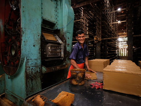 Colombo, Sri Lanka - Sep 8, 2015. A man with smila at an old brick factory in Colombo, Sri Lanka. Colombo is the financial centre of the island and a popular tourist destination.のeditorial素材
