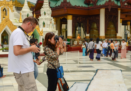 Yangon, Myanmar - Oct 1, 2011. People visit the Shwedagon Pagoda in Yangon, Myanmar. Shwedagon is the most sacred Buddhist pagoda in Myanmar.のeditorial素材