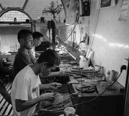 Bagan, Myanmar - Feb 19, 2016. Burmese men working at a jewellery shop in Bagan, Myanmar. Bagan is home to the largest and densest concentration of Buddhist temples.のeditorial素材