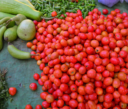 Red tomatoes at vegetables market in Yangon, Myanmar.の写真素材