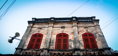 Beautiful old house with red windows in Hoi An ancient town, Vietnam. Hoi an is recognized as a World Heritage Site by UNESCO.のeditorial素材