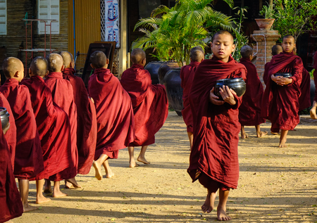Bagan, Myanmar - Feb 4, 2017. Buddhist novices walking for alms in Bagan, Myanmar. Bagan is an ancient city located in the Mandalay Region of Myanmar.のeditorial素材