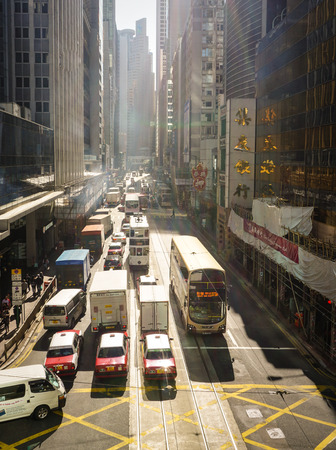 Hong Kong - Dec 30, 2014. Traffic at main street in Hong Kong, China. Hong Kong is one of the most popular destinations in the world with 40 millions visitors per year.のeditorial素材