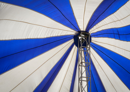 Blue and white canopy for a party at the sunny day on the tropical beachの写真素材