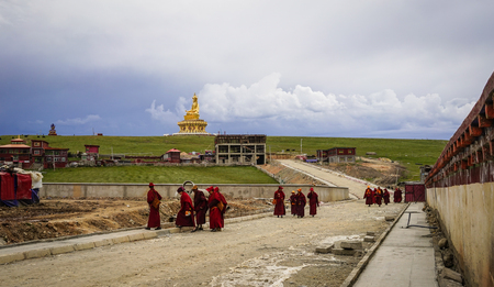 Sichuan, China - Aug 18, 2016. Monks walking at Yarchen Gar Monastery in Garze, Sichuan, China....