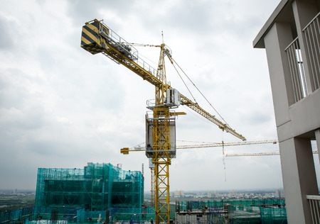 Saigon, Vietnam - Jun 16, 2015. A crane at construction site in Saigon, Vietnam. Saigon is the highest population-concentrated city in the country.のeditorial素材