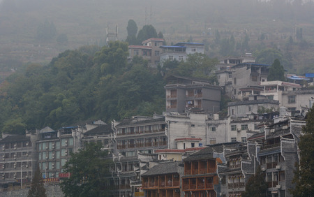 Hunan, China - Nov 6, 2015. Old houses ol the hill at Fenghuang Ancient Town in Hunan, China. Fenghuang is still be kept in its original appearance with 300 years passed.のeditorial素材