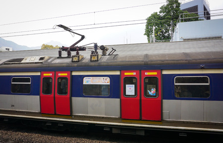 Hong Kong - Dec 26, 2014. Train at railway station in Hong Kong, China. Hong Kong has a highly...