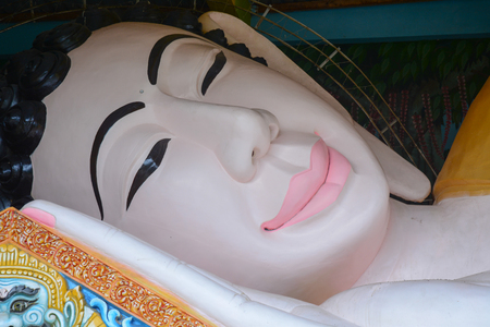 An Giang, Vietnam - Oct 3, 2015. Portrait of Lying Buddha statue at Khmer temple in An Giang, Vietnam. An Giang is concentration of large population of Khmer community in Vietnam.の写真素材