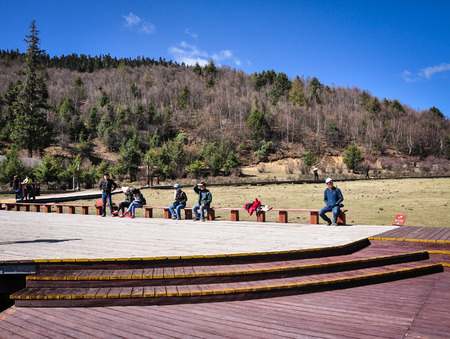 Yunnan, China - May 1, 2014. People relax at Pudacuo National Park in Shangri-la, Yunnan, China. Potatso National Park is famous for clear lakes, primitive forest and rare animals.のeditorial素材