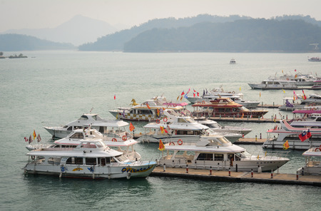 Taichung, Taiwan - Mar 16, 2015. Tourist jetty on the Sun Moon Lake in Nantou, Taiwan. Sun Moon Lake is the largest body of water in Taiwan as well as a tourist attraction.のeditorial素材