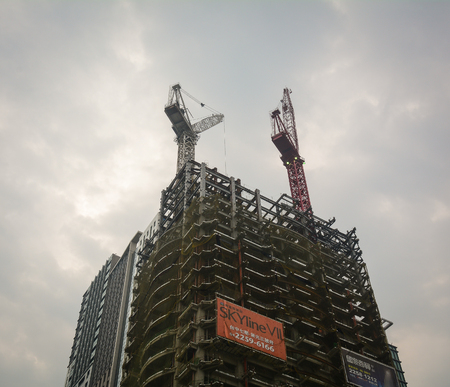 Taichung, Taiwan - Mar 16, 2015. A building construction site at downtown in Taichung, Taiwan. Taichung is the third largest city in Taiwan, with population of over 2.7 million people.のeditorial素材