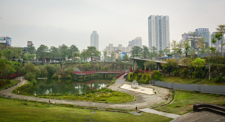Taichung, Taiwan - Mar 16, 2015. Cityscape with public park in Taichung, Taiwan. Taichung is the third largest city in Taiwan, with population of over 2.7 million people.のeditorial素材