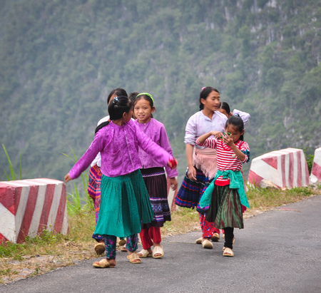 Ha Giang, Vietnam - Oct 13, 2014. Hmong women on mountain road in Ha Giang province, Vietnam. Ha Giang shares a 270 km long border with Yunnan province of southern China.のeditorial素材