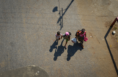 Yangon, Myanmar - Feb 13, 2017. People walking on main street at business district in Yangon, Myanmar. Yangon is the country main centre for trade, industry and tourism.のeditorial素材
