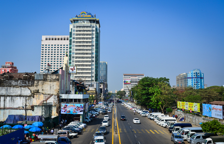 Yangon, Myanmar - Feb 13, 2017. Traffic on main street at business district in Yangon, Myanmar. Yangon is the country main centre for trade, industry and tourism.のeditorial素材