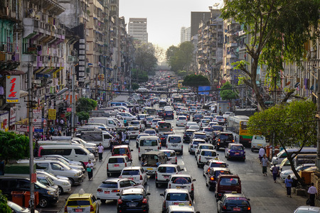 Yangon, Myanmar - Feb 13, 2017. Traffic on Sule Street in Yangon, Myanmar. Yangon is the largest...