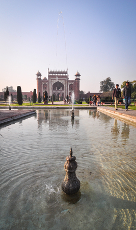 Agra, India - Mar 10, 2012. View of Taj Mahal with fountain in Agra, India. It is one of the worlds most celebrated structures and a symbol of Indias rich history.のeditorial素材