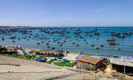 Phan Thiet, Vietnam - Mar 26, 2017. Many fishing boats docking on the bay in Mui Ne town, Phan Thiet, Vietnam. Mui Ne is a coastal fishing town in the Southern Vietnam.のeditorial素材