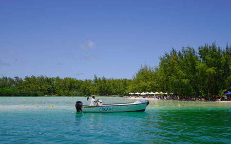 Flacq, Mauritius - Jan 12, 2017. A small boat on the sea in Ile aux Cerfs, Mauritius. Ile aux Cerfs is by far the most popular and reputed island destination in Mauritius.のeditorial素材