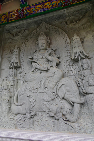 Hong Kong - Mar 31, 2017. The Bodhisattva statue in interior of the temple, Po Lin Monastery in Hong Kong. The Po Lin Monastery is located in Ngong Ping on Lantau Island.のeditorial素材