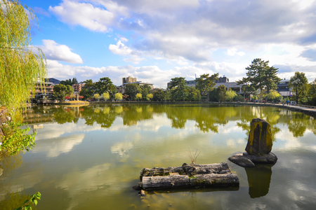 Nara, Japan - Nov 25, 2016. Landscape of city park with the lake at autumn in Nara, Japan. Nara is the Japan first permanent capital was established in the year 710 at Heijo.のeditorial素材