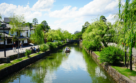 Okayama, Japan - Jun 14, 2015. View of the canal with many trees at Kurashiki Ancient Town in Okayama, Japan. Kurashiki is a historic city located in western Okayama Prefecture.のeditorial素材