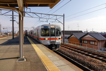 Tokyo, Japan - Dec 25, 2015. A JR train coming to the railway station in Tokyo, Japan. Railways are the most important means of passenger transportation in Japan.のeditorial素材