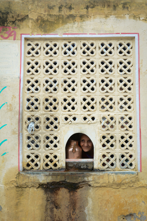 Jaipur, India - Jul 27, 2015. An Indian with water pot at an old building in Jaipur, India. Jaipur, known as the Pink city, is a major tourist destination in India.のeditorial素材
