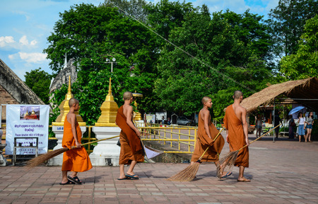 Chiang Mai, Thailand - Jun 22, 2016. Buddhist monks working at pagoda in Chiang Mai, Thailand. From 1296, under King Mengrai, Chiang Mai was the cultural and religious center of the northern Thailand.のeditorial素材