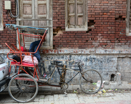 Amritsar, India - Jul 25, 2015. Rickshaw waiting for passengers on street in Amritsar, India. Amritsar is one of the largest cities of the Punjab state in India, and a holy city for the Sikhs.のeditorial素材