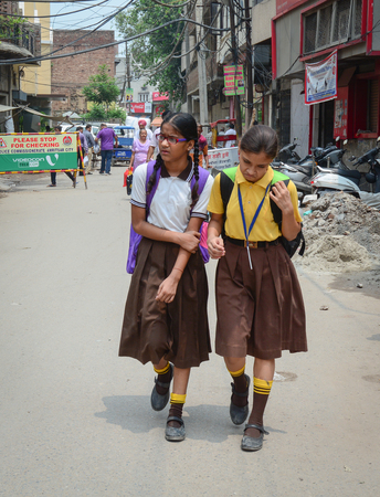 Amritsar, India - Jul 25, 2015. Students walk on street in Amritsar, India. Amritsar is one of the largest cities of the Punjab state in India, and a holy city for the Sikhs.のeditorial素材