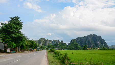 Hanoi, Vietnam - May 25, 2016. Mountain road with paddy rice field in Hanoi, Vietnam. Hanoi is the capital of Vietnam and the country second largest city by population.のeditorial素材