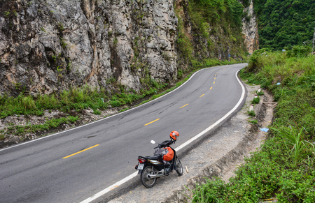 Sapa, Vietnam - May 25, 2016. A motorbike parking on mountain road in Sapa, Vietnam. Sapa is a frontier township and capital of Sa Pa District in north-west Vietnam.のeditorial素材