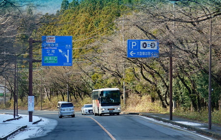 Nikko, Japan - Jan 2, 2016. Vehicles run on mountain road at sunny day in Nikko, Japan. Nikko is a popular destination for Japanese and international tourists.のeditorial素材