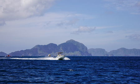 El Nido, Philippines - Apr 7, 2017. A speedboat running on the sea in El Nido, Philippines. El Nido is a coastal settlement and major tourist destination in Philippines.のeditorial素材