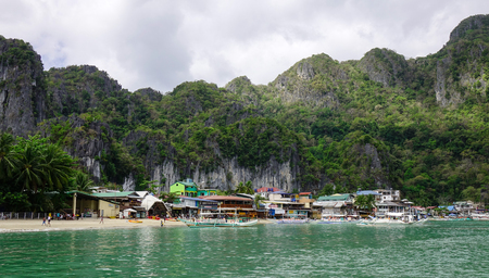 El Nido, Philippines - Apr 7, 2017. Landscape of the beach with many hotels in El Nido, Philippines. El Nido is a coastal settlement and major tourist destination in Philippines.のeditorial素材