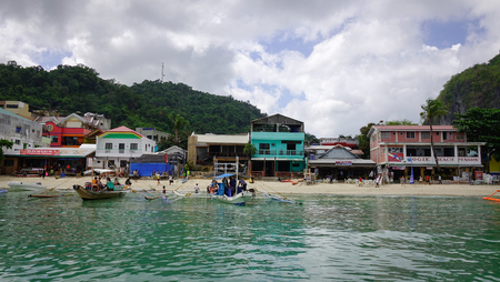 El Nido, Philippines - Apr 7, 2017. Many wooden boats docking on beach in El Nido, Philippines. El Nido is a coastal settlement and major tourist destination in Philippines.のeditorial素材