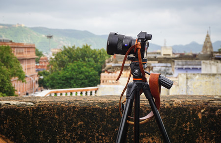 Jaipur, India - Jul 28, 2015. A digital mirrorless camera with tripod on the old building in Jaipur, India. Jaipur is the capital and largest city of the Indian state of Rajasthan.のeditorial素材